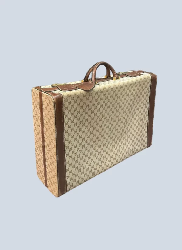 <b>Gucci</b> <br> valigia rigida vintage in tela Monogram e pelle.
