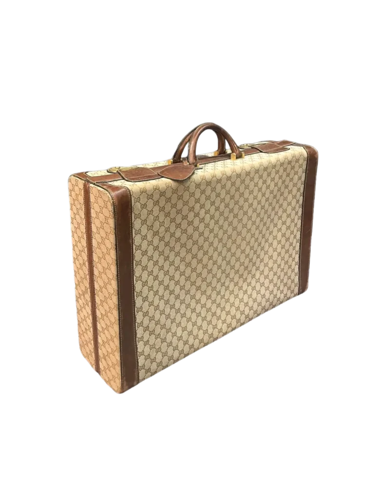 Vintage hard-shell suitcase in Monogram canvas and leather.