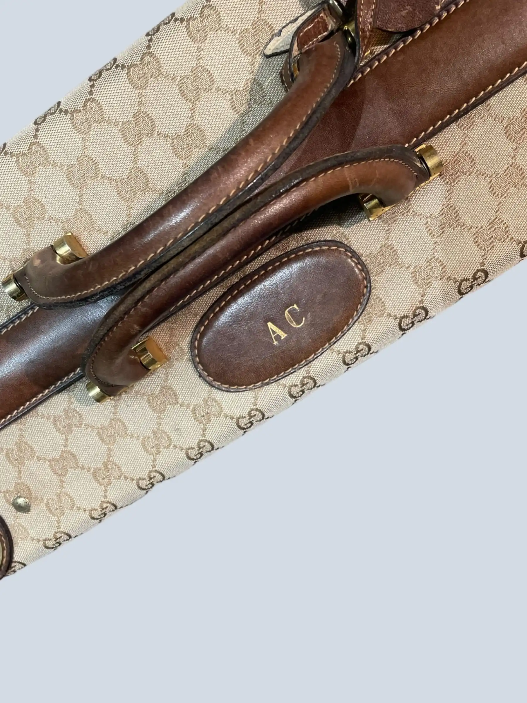 Gucci valigia rigida vintage in tela Monogram e pelle