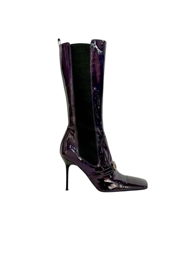 Patent leather boots with rhinestone logo.