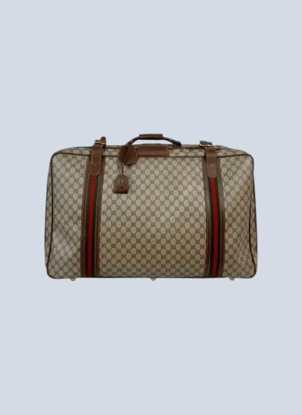 <b>Gucci</b> <br> valigia in pelle e tela Monogram.