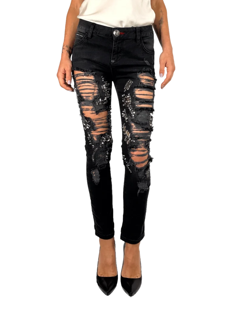 Disrupted denim trousers with studs.