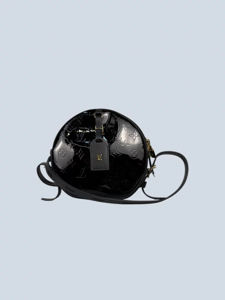 Boite Chapeau Souple patent leather crossbody bag.