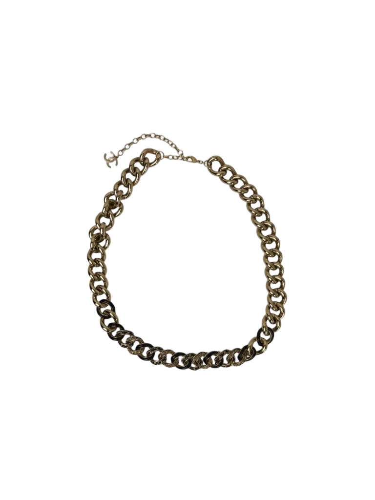 Metal and leather necklace.