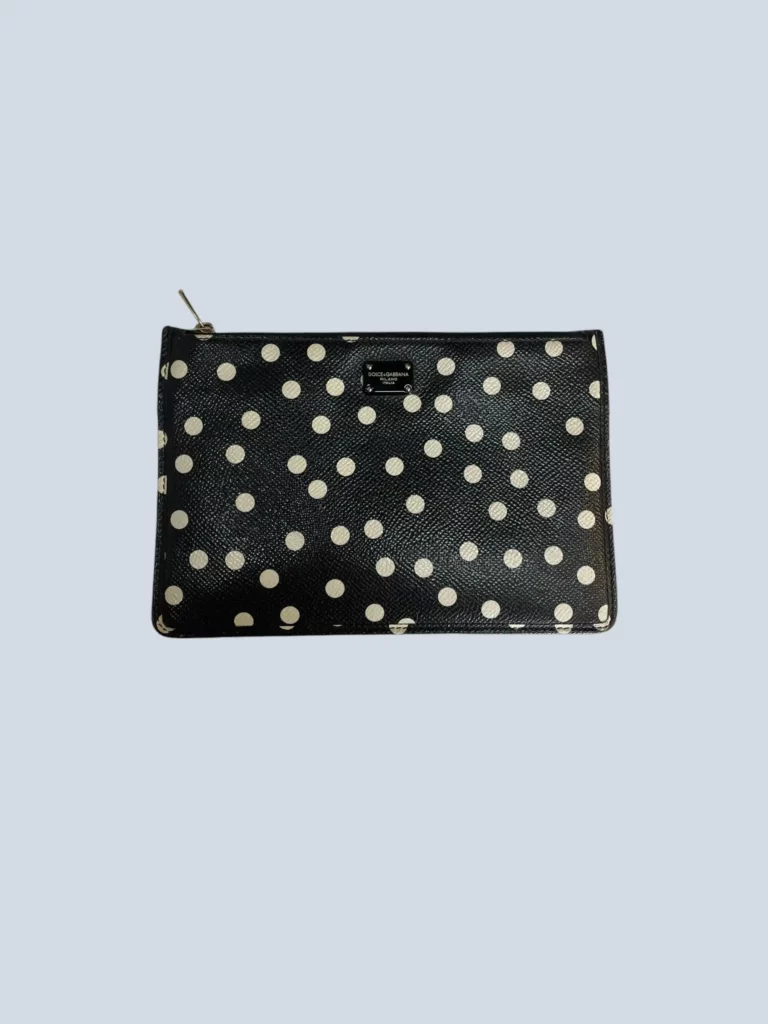 Large grained leather card holder with polka dot pattern.