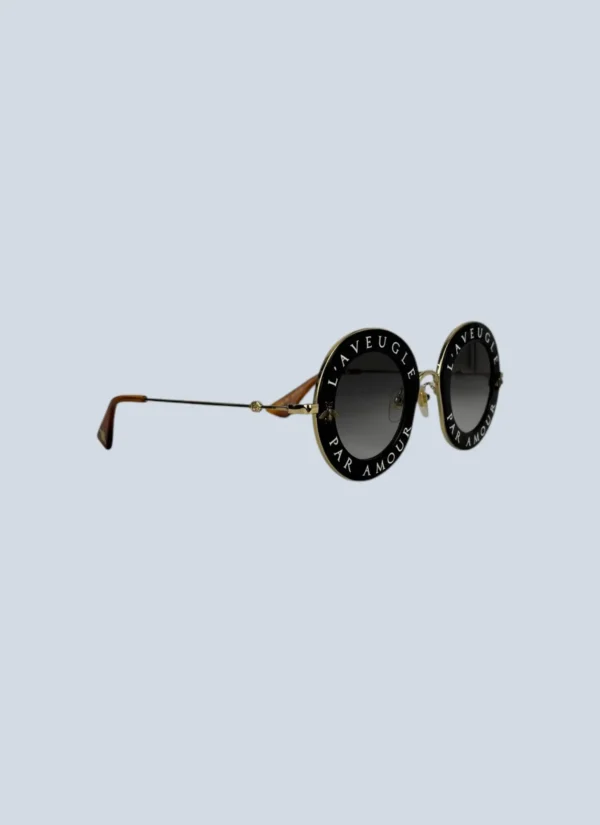 <b>Gucci</b> <br> occhiali da sole “L’aveugle par amour” in metallo.