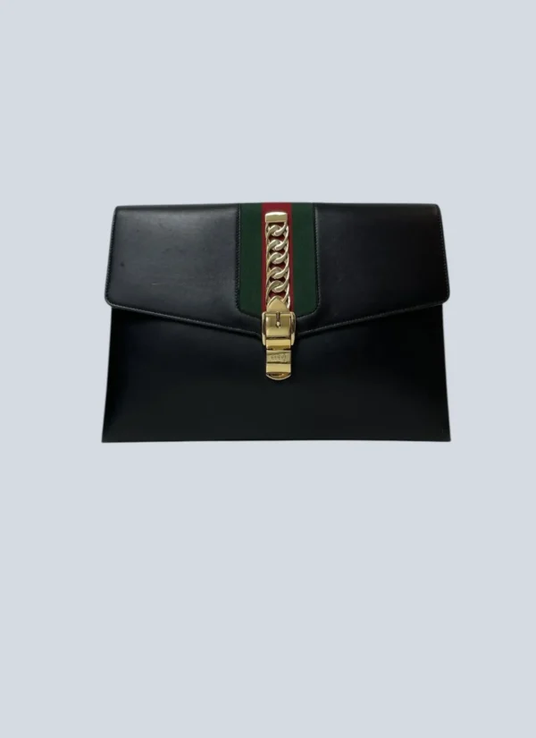 <b>Gucci</b><br> clutch Sylvie in pelle e banda web.