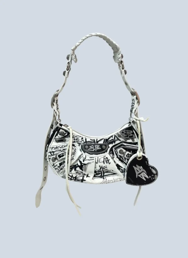 <b>Balenciaga</b><br> borsa a spalla Le Cagole XS Graffiti in pelle.