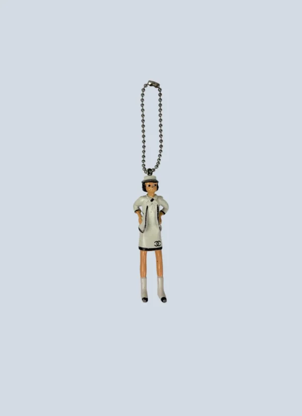 <b>Chanel</b> <br> portachiavi bambolina in gomma.