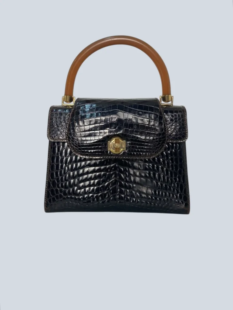 Borsa a mano vintage in pelle di coccodrillo lucida.