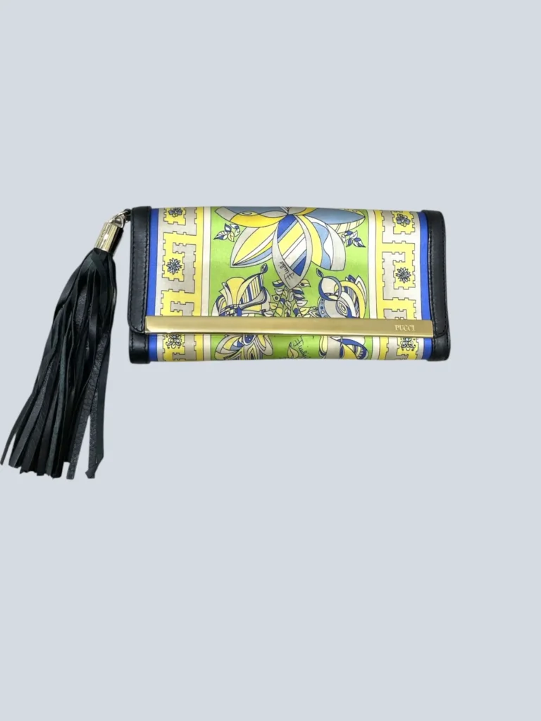 Satin and leather clutch with tassel.