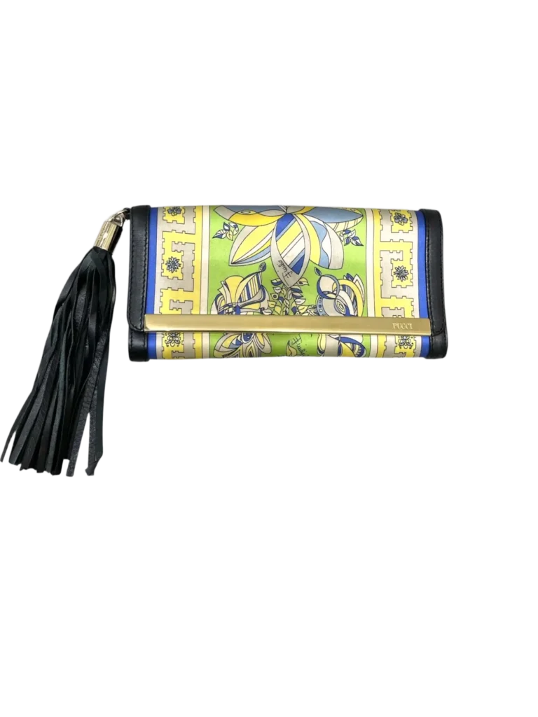 Satin and leather clutch with tassel.