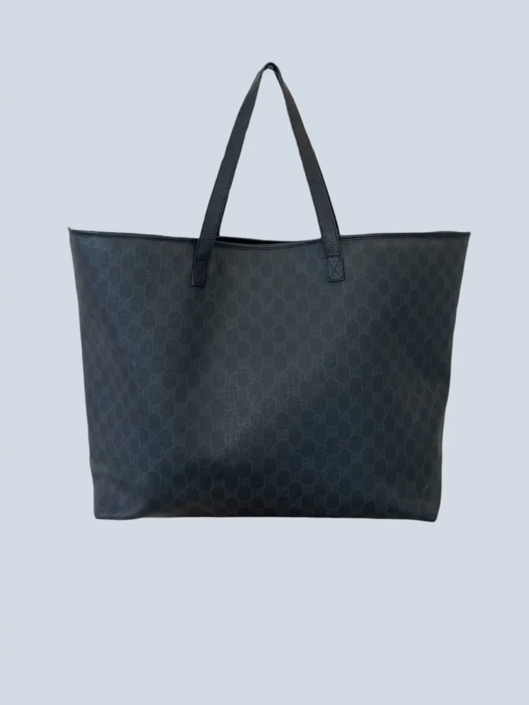 Monogram canvas and leather shoulder shopper bag.