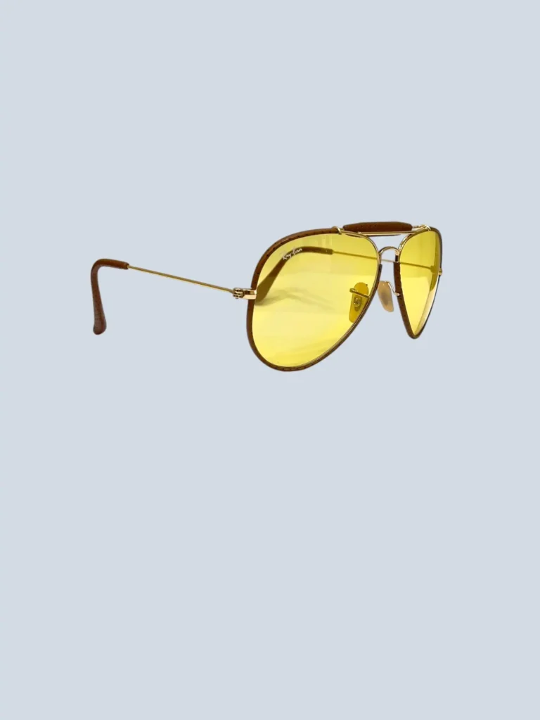 Metal and perforated leather aviator sunglasses.