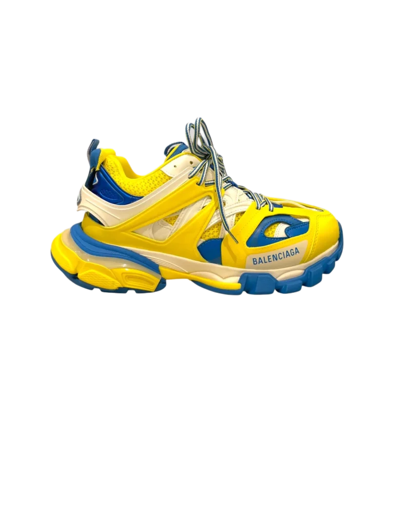 Sneakers Balenciaga Track in pelle e gomma viste di lato, colorate di giallo e blu.